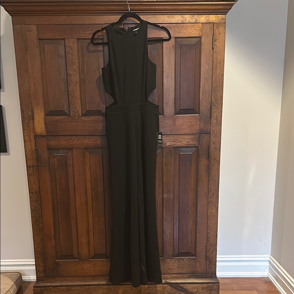 Wide leg jumpsuit with side cutouts. NWT